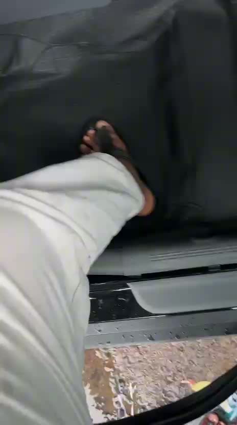 Still from supplied footage showing footwear on an interior floor covering